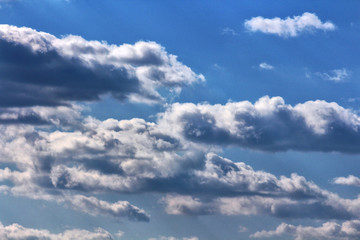Fototapeta na wymiar Blue sky with white and grey clouds