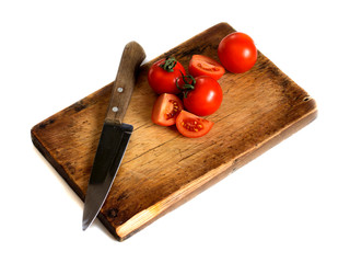 Fresh tomatoes on rustic wooden background