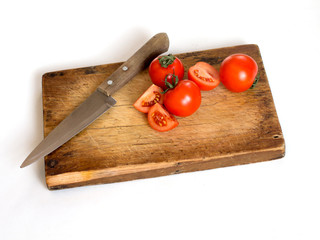 Fresh tomatoes on rustic wooden background