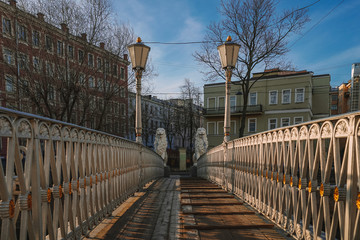 Sights of Saint Petersburg, morning spring, bridge with statues of white lions