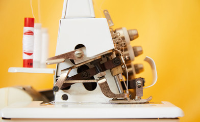 Soviet made overlock, subject shooting, yellow background.