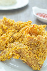 Ayam goreng crispy or fried chicken crispy on white plate.