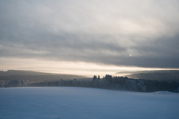 relaxing overcast moudy clouds in a winter valley while sunrise and sundown in a uphill winter...