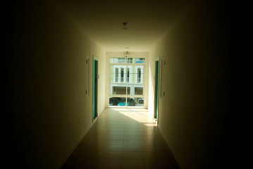 Walkway to the window with doors flanking on both sides of the condo