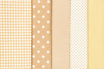 Mix of beige, white and brown cotton fabric.