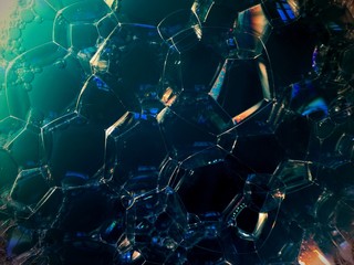 Soap bubbles on dark background. noise film grain so conceived, background texture
