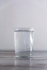 A glass of water on a white background. Drink macro photography