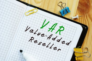 The photo shows Value-Added Reseller VAR. Notepad, heap, marker.