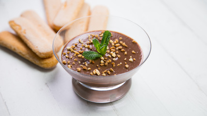 Sweet chocolate cream dessert with nuts