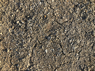 Cracked dry ground mud, dried under sun road