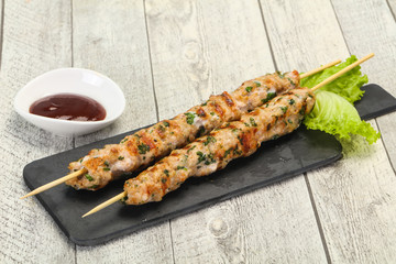 Minced pork skewer kebab with sauce