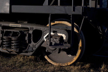 A closeup view of the wheels of a train