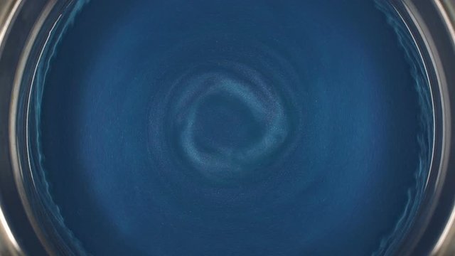 Rheoscopic fluid. Beautiful movement of particles in a liquid. Fantastic patterns and shapes. 50 fps