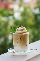 Trendy iced frothy ultra fluffy Dalgona instant Coffee drink