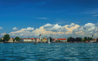 The Lindau embankment, the New lighthouse, the Bavarian lion and the Mangturm tower. lake Constance. Germany. Soft focus, blurry background.