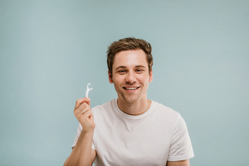 Man using dental floss