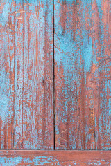 Red blue old wooden wall with cracks
