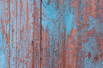 Red blue old wooden wall with cracks