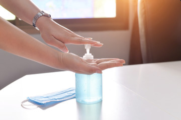 women washing hands with alcohol gel or antibacterial soap sanitizer in office Hygiene concept. prevent the spread of germs and bacteria and avoid infections corona virus