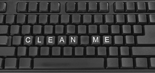 Text on PC keyboard - Clean me. Coronavirus. Quarantine. Coronavirus pandemic in the world.