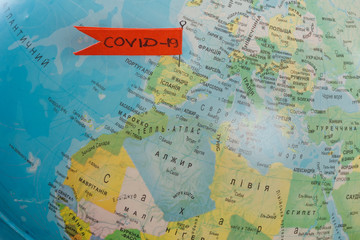 Corona virus on a world globe