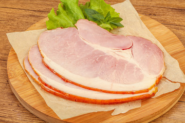 Sliced pork belly over board