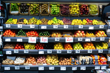 Raw fresh vegetables and fruits assortment on counter
