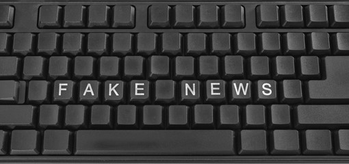 Text on PC keyboard - fake news. Coronavirus. Quarantine. Coronavirus pandemic in the world.