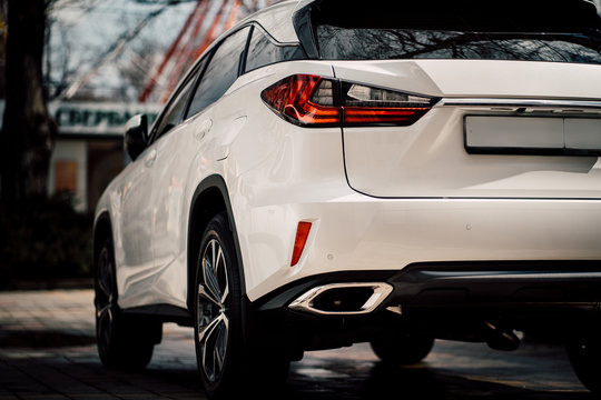 Close up photo of back view luxury car with futuristic tail lights
