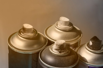 spray cans with paint, spray cans in paint