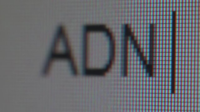 Messaging using abbreviations ADN. Extra close up of letters appearing on screen.