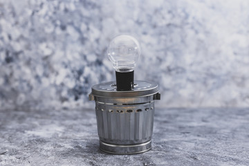 ideas for waste management and recycling concept, light bulb on tp of garbage bin