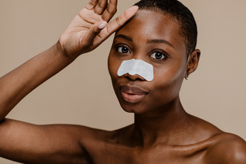 African woman using nose strip