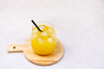 Composition With Two Glasses of Tasty Orange Juice Healthy VitaminBeverage with Ice Summer Drink Gray Background Horizontal Copy Space