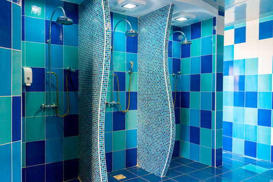 Public shower room with several showers