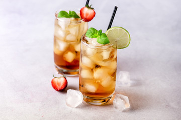 Gasses of Cold Citrus and Strawberry Ice Tea Decorated with Slice of Lemon and Strawberry Healthy Summer Drink Horizontal