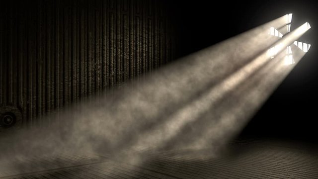 Sunlight beams shining through industrial factory fan lighting a dark factory room floor. Abstract industrial seamlessly looped background.