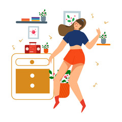 Young women happy at home listening the music, dancing and in period of self and social distancing during covid 19 virus epidemic. 