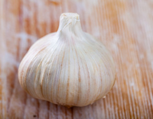Garlic on wooden table closeup