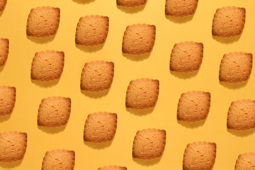 Baking still life of crunchy cookies on yellow