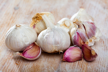 Garlic on wooden table closeup