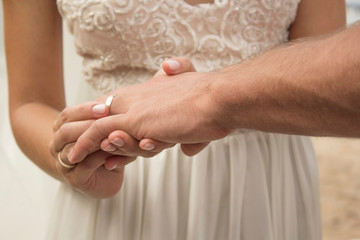 Fototapeta premium exchange of rings at the wedding of the bride and groom, romance