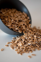 oatmeal in gray bowl spilling out