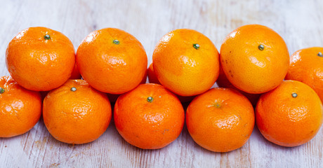 Clementines on wooden background © JackF