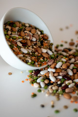 mixed legumes in bowl spilling out