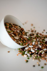 mixed legumes in bowl spilling out