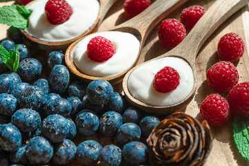 Yogurt with spoons,Healthy breakfast with Fresh greek yogurt, muesli on background