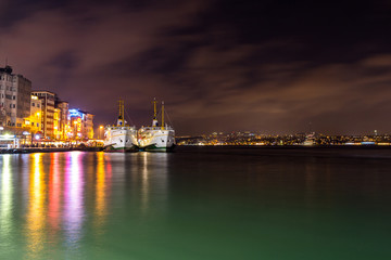 Fototapeta na wymiar Two ferries on the pier at night in Istanbul. Turkey