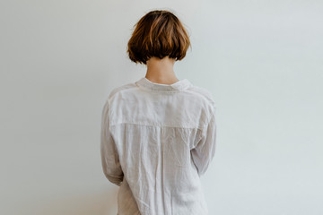 Woman in a white linen shirt - 339485985