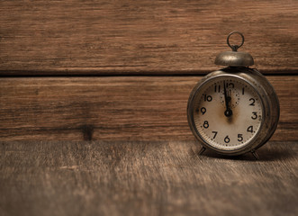 vintage watch on a wooden background. there is a place for text